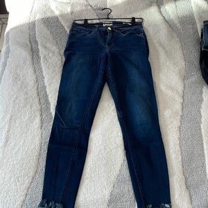 Frame skinny jeans with frayed bottoms